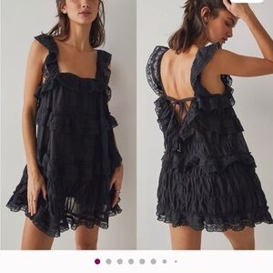 Free People Tiered and True Black Ruffled
Romper Elegant Black Ruffle Dress